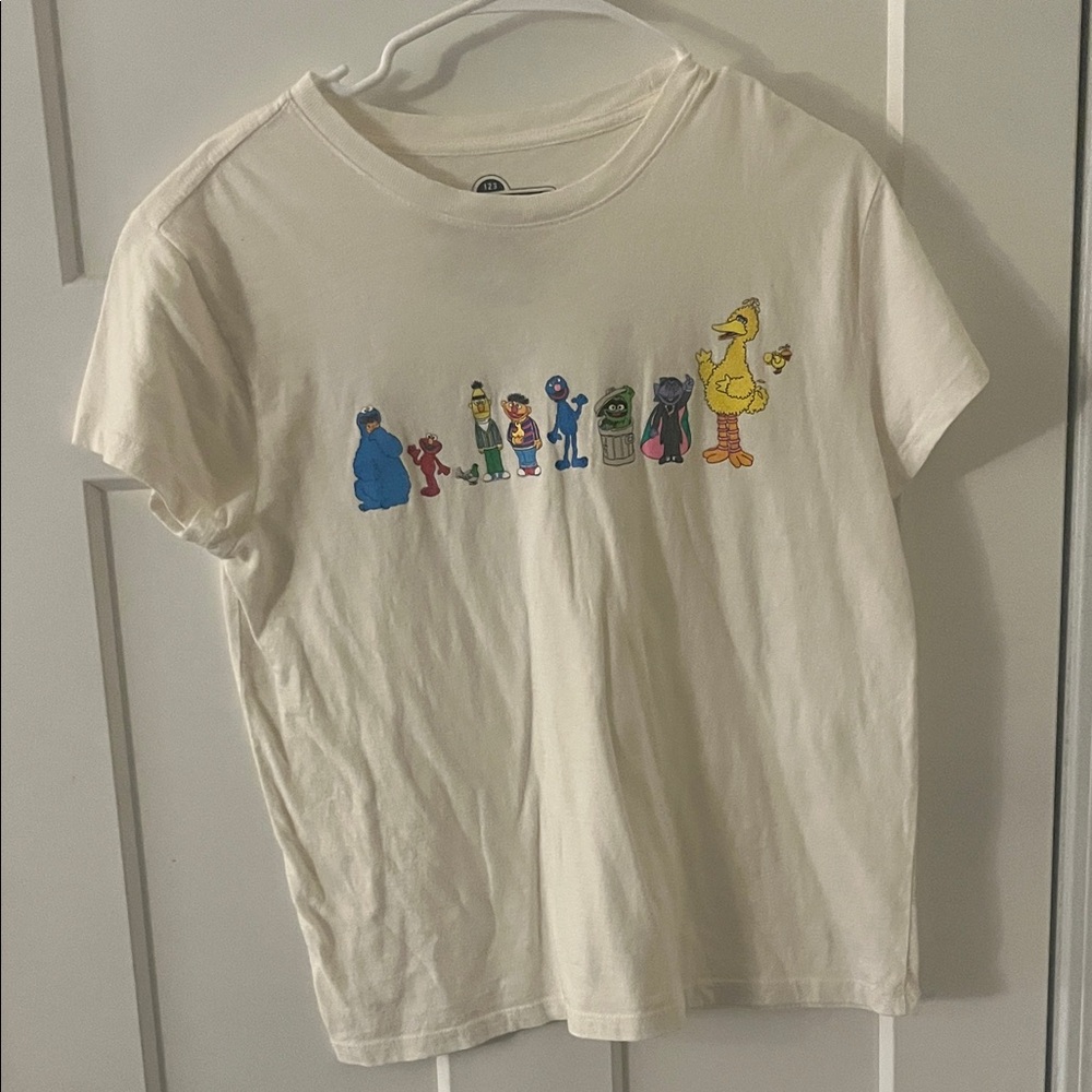 Sesame Street Cream Short Sleeve Tee with Multicolor Character Row